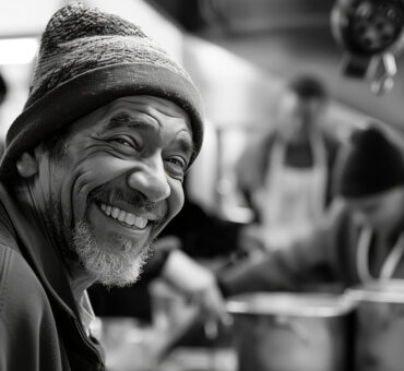 Smiling man wearing beanie in kitchen